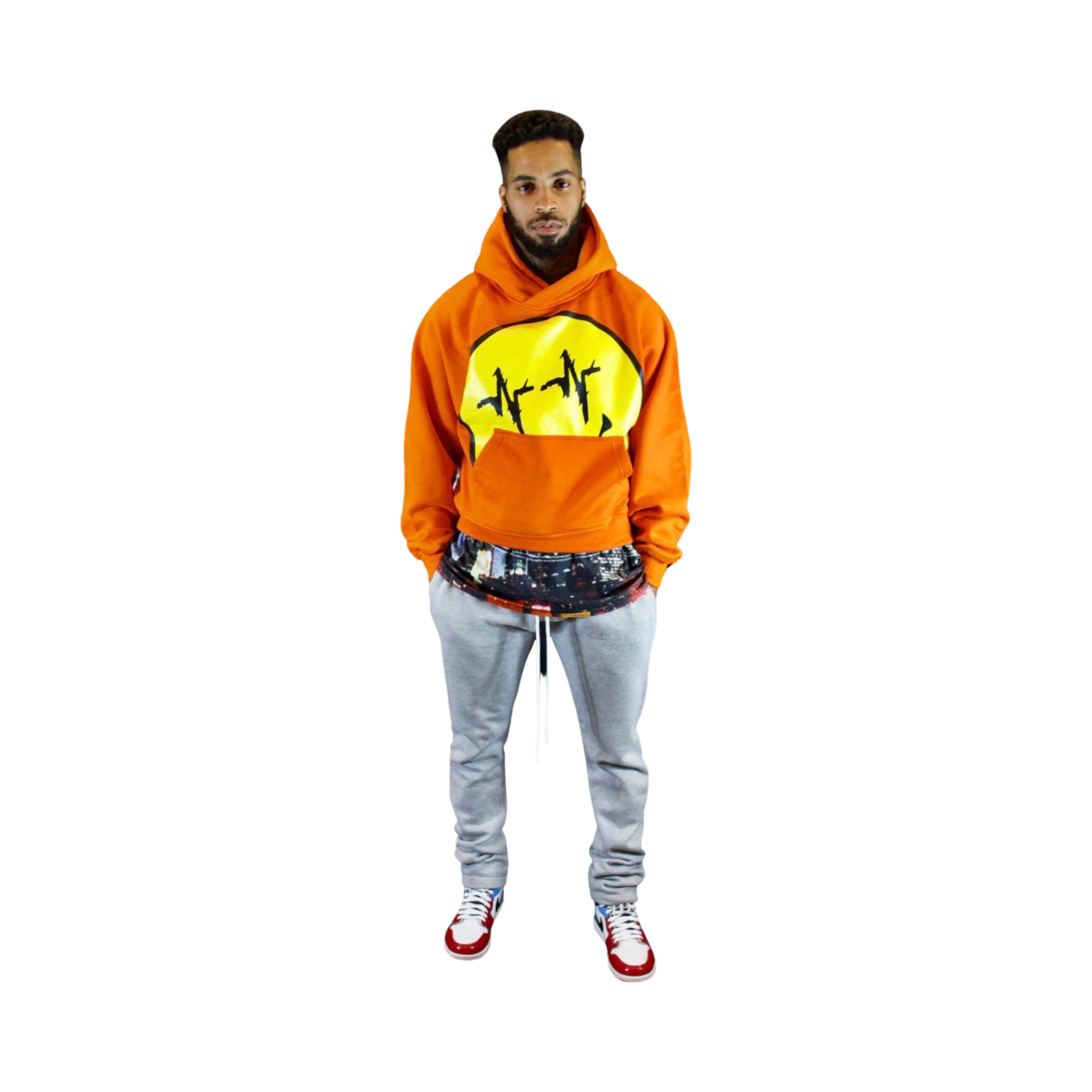 Model featured in Endless Edge orange oversized hoodie with Smiley Face logo, Endless Edge city view t-shirt, and Endless Edge grey extended sweatpants